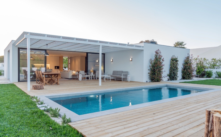 Modern villa with pool and deck with interior.