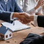 A couple sign a mortgage agreement.